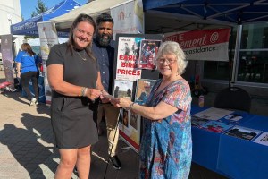Nanaimo International Film Screening Society Board members Lisa Chew and Mathews Tharakan present the $100 Black Rabbit Restaurant gift certificate to Jennifer Ross, who won the draw in early bird season ticket sales.