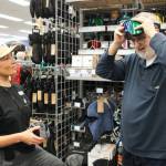 Alex Pavez assists Bruce Hawker, who wanted to buy goggles at the grand opening of Mountain Equipment Company&rsquo;s Nanaimo shop on Dec. 13. (Karl Yu/News Bulletin)